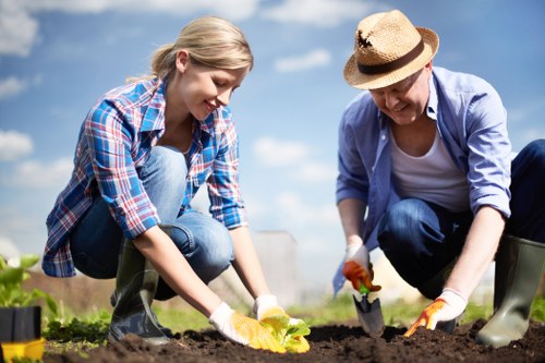 Professional gardeners working on a lush garden